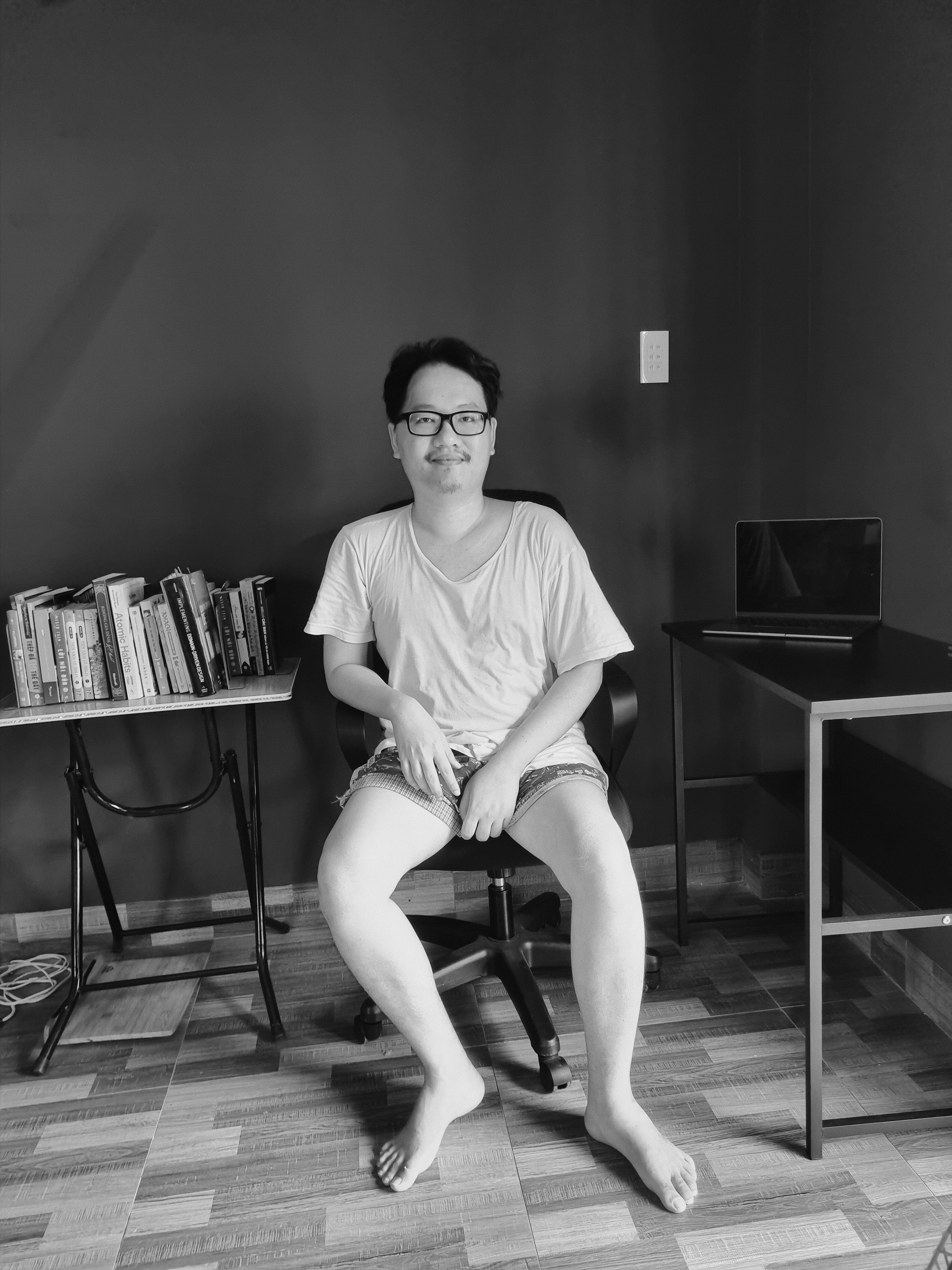 A person sitting at a desk in front of a computer